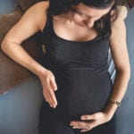 Expectant mom holding baby belly