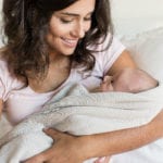 baby sleeping with mom